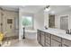 Contemporary bathroom with separate shower, soaking tub, and double sink vanity at 1128 E Shoreview Rd, Mcdonough, GA 30253