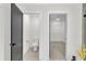 Stylish bathroom with a view to the water closet and a large walk-in closet at 1128 E Shoreview Rd, Mcdonough, GA 30253