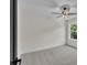 Bright bedroom with neutral carpet and a large window overlooking trees at 1128 E Shoreview Rd, Mcdonough, GA 30253