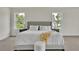 Bright bedroom features natural light from large windows and a neutral color palette at 1128 E Shoreview Rd, Mcdonough, GA 30253
