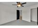 Spacious bedroom with neutral carpet, modern ceiling fan, and a closet at 1128 E Shoreview Rd, Mcdonough, GA 30253