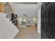 Bright entryway with hardwood floors, a staircase with wrought iron railing, and a view into the open living area at 1128 E Shoreview Rd, Mcdonough, GA 30253