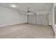 Spacious two-car garage with ample room for vehicles and storage featuring a neutral color scheme at 1128 E Shoreview Rd, Mcdonough, GA 30253