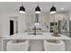 Modern kitchen with stainless steel appliances, white marble countertops, and island seating at 1128 E Shoreview Rd, Mcdonough, GA 30253
