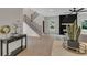 Open-concept living space with fireplace, staircase, and views of the kitchen island and dining area at 1128 E Shoreview Rd, Mcdonough, GA 30253