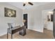 Home office with modern desk, neutral walls, and access to a half-bathroom at 1128 E Shoreview Rd, Mcdonough, GA 30253