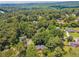 Aerial view of property in lush green neighborhood with mountain views at 3835 Thornhill Sw Dr, Lilburn, GA 30047