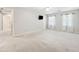 Bedroom with carpet, ceiling fan, sheer curtains and mounted television at 3835 Thornhill Sw Dr, Lilburn, GA 30047