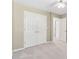 Bedroom with carpet, large closet, and neutral paint at 3835 Thornhill Sw Dr, Lilburn, GA 30047