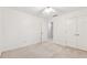 A simple bedroom with white walls and carpet including a double closet at 3835 Thornhill Sw Dr, Lilburn, GA 30047