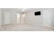 Bedroom with carpet, ceiling fan, and mounted television at 3835 Thornhill Sw Dr, Lilburn, GA 30047