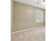 Bedroom with neutral carpet, ceiling fan, and window at 3835 Thornhill Sw Dr, Lilburn, GA 30047