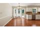 Bright kitchen featuring stainless steel appliances, granite countertops, breakfast bar, and adjacent breakfast area at 3835 Thornhill Sw Dr, Lilburn, GA 30047