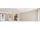 Bright living room featuring a brick fireplace with built-in shelves and neutral-toned walls and carpet at 3835 Thornhill Sw Dr, Lilburn, GA 30047