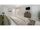 Spacious main bedroom featuring neutral paint, carpet, ceiling fan, and en-suite bathroom at 3835 Thornhill Sw Dr, Lilburn, GA 30047