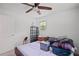 Bright bedroom with a ceiling fan, natural light, and a closet or storage space at 4051 Dixie Ln, Douglasville, GA 30135
