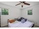 Bedroom featuring two windows, a ceiling fan, and neutral-toned walls at 4051 Dixie Ln, Douglasville, GA 30135