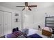 Bedroom with a ceiling fan, closet space, and lots of natural light at 4051 Dixie Ln, Douglasville, GA 30135