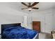 Comfortable bedroom with ceiling fan, dresser, and closet at 4051 Dixie Ln, Douglasville, GA 30135