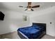 Bedroom with large ceiling fan, wall-mounted television and one window at 4051 Dixie Ln, Douglasville, GA 30135