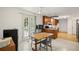 Bright dining room with a table, cabinets and a door leading to the backyard at 4051 Dixie Ln, Douglasville, GA 30135