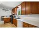 Functional kitchen featuring white countertops, stainless steel appliances, and wooden cabinets at 4051 Dixie Ln, Douglasville, GA 30135