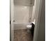 Upstairs bathroom features a shower/tub combo, toilet, and vanity at 5752 Little River Rd, Atlanta, GA 30349