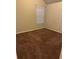 A spare bedroom is complete with carpet and neutral walls at 5752 Little River Rd, Atlanta, GA 30349