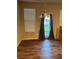 Open dining area with hardwood floors and a window with curtains and blinds at 5752 Little River Rd, Atlanta, GA 30349