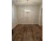 Dining room featuring gleaming hardwood floors and a elegant chandelier at 5752 Little River Rd, Atlanta, GA 30349