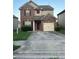 Two-story brick home with a attached one car garage and a well-manicured lawn at 5752 Little River Rd, Atlanta, GA 30349
