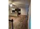 Open-concept living room with hardwood floors and a granite breakfast bar at 5752 Little River Rd, Atlanta, GA 30349