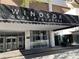 Windsor Over Peachtree entrance with covered portico and glass entry doors at 620 Peachtree #901 Ne St, Atlanta, GA 30308
