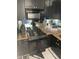 Stylish black kitchen featuring granite countertops and stainless steel appliances at 620 Peachtree #901 Ne St, Atlanta, GA 30308