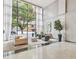 Elegant lobby area with large windows and stylish seating at 620 Peachtree #901 Ne St, Atlanta, GA 30308
