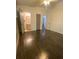 Cozy bedroom with wood flooring, doorway to an adjoining bathroom, and a minimalist aesthetic at 6264 Godfrey Sw Dr, Mableton, GA 30126