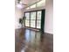 Bright living room with hardwood floors, large windows, and a view to the greenery outside at 6264 Godfrey Sw Dr, Mableton, GA 30126
