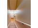 Inviting hallway featuring carpeted stairs, a front door, and a convenient coat closet at 805 Pleasant Hill Nw Rd # 343, Lilburn, GA 30047
