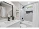 Bathroom featuring a tub-shower combo, sleek vanity and modern fixtures at 942 Mclinden Se Ave, Smyrna, GA 30080