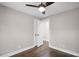 This bedroom provides pristine white trim with gleaming hardwood flooring and a ceiling fan at 942 Mclinden Se Ave, Smyrna, GA 30080