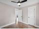Bedroom with neutral paint, hardwood floors, ceiling fan and white trim at 942 Mclinden Se Ave, Smyrna, GA 30080