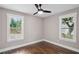 Bedroom with two windows, a ceiling fan and hardwood floors at 942 Mclinden Se Ave, Smyrna, GA 30080