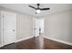 Spacious bedroom with ceiling fan, hardwood floors, and freshly painted walls at 942 Mclinden Se Ave, Smyrna, GA 30080
