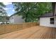 Wide shot of a wooden deck, showing its design and size relative to the house at 942 Mclinden Se Ave, Smyrna, GA 30080