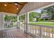 Charming front porch with wood ceiling, white railing and columns, offering a welcoming entrance at 942 Mclinden Se Ave, Smyrna, GA 30080