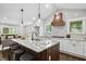 Well-appointed kitchen with a large island, stainless steel appliances, and bright lighting at 942 Mclinden Se Ave, Smyrna, GA 30080
