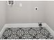 Laundry area with black and white patterned flooring and laundry hookups, clean and efficient at 942 Mclinden Se Ave, Smyrna, GA 30080