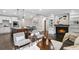 Open living space with kitchen, dining area, and a cozy living room fireplace at 942 Mclinden Se Ave, Smyrna, GA 30080