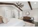 Bright main bedroom featuring hardwood floors, a ceiling fan and wooden beams at 942 Mclinden Se Ave, Smyrna, GA 30080