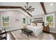 Bright and airy main bedroom with vaulted ceiling, wooden beams, and large windows at 942 Mclinden Se Ave, Smyrna, GA 30080